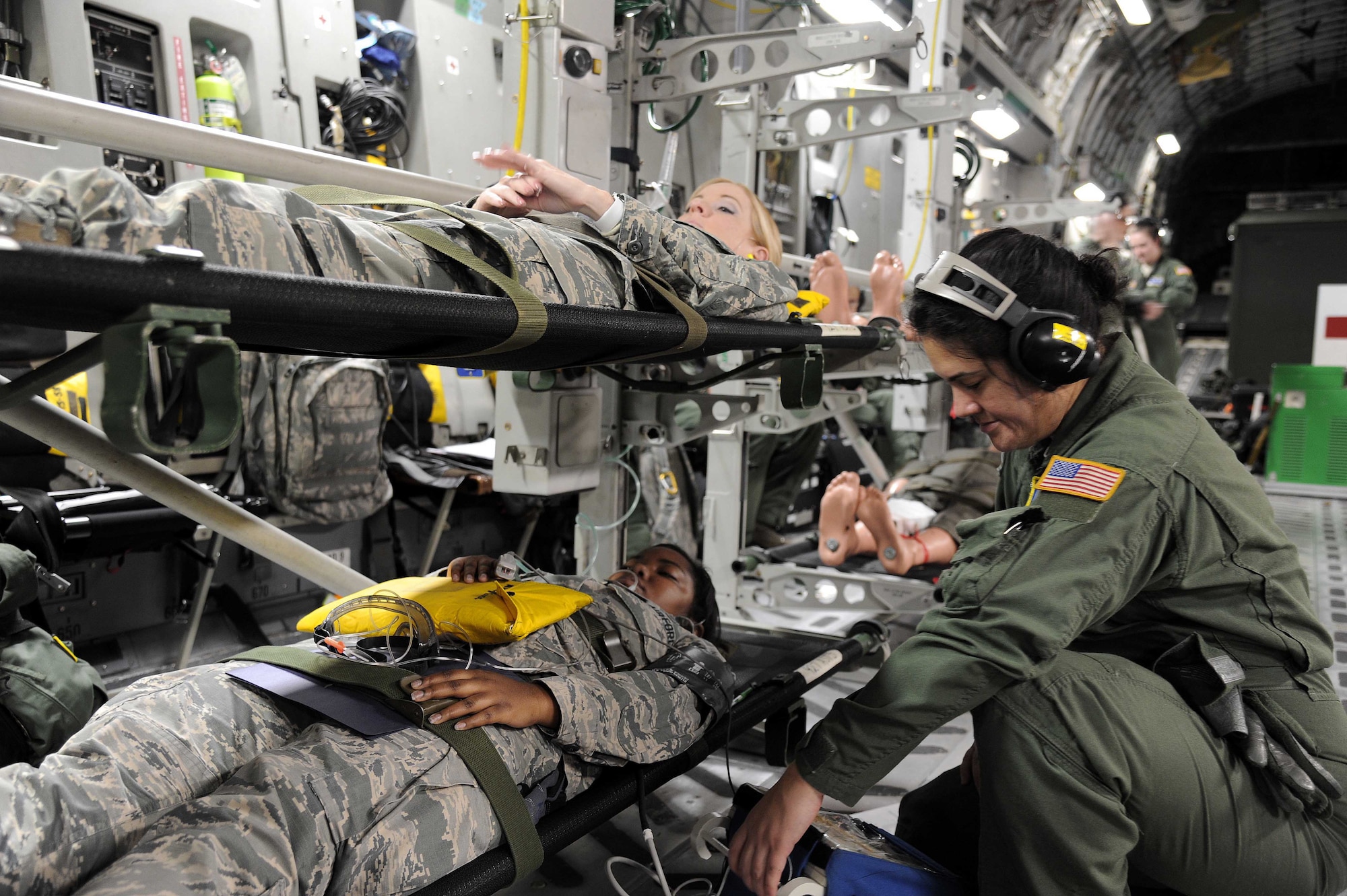 Master Sgt. Darlena Martens 446th Aeromedical Evacuation Squadron medical technician observes a patient’s vital signs during an aeromedical evacuation exercise Feb. 2, 2017 at Dobbins Air Reserve Base, Ga. This training opportunity provided Airmen a chance to work with members from other bases and strengthen partnerships. (U.S. Air Force Photo by Tech Sgt. Peter Dean)