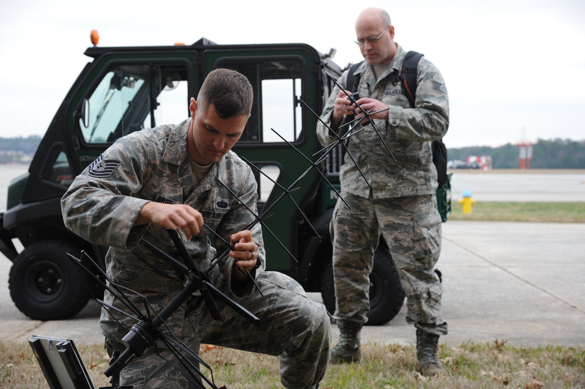 Technical Sgt. Brian Large, 45th Aeromedical Evacuation Squadron communication journeyman, sets up a satellite antenna during an exercise at MacDill Air Force Base, FL, Feb. 2, 2017.  The exercise was large-scale simulation of what members could expect in a deployed environment, designed to enhance the operability of Airmen and force them to work outside their normal conditions. (U.S. Air Force Photo by Staff Sgt. Xavier Lockley)