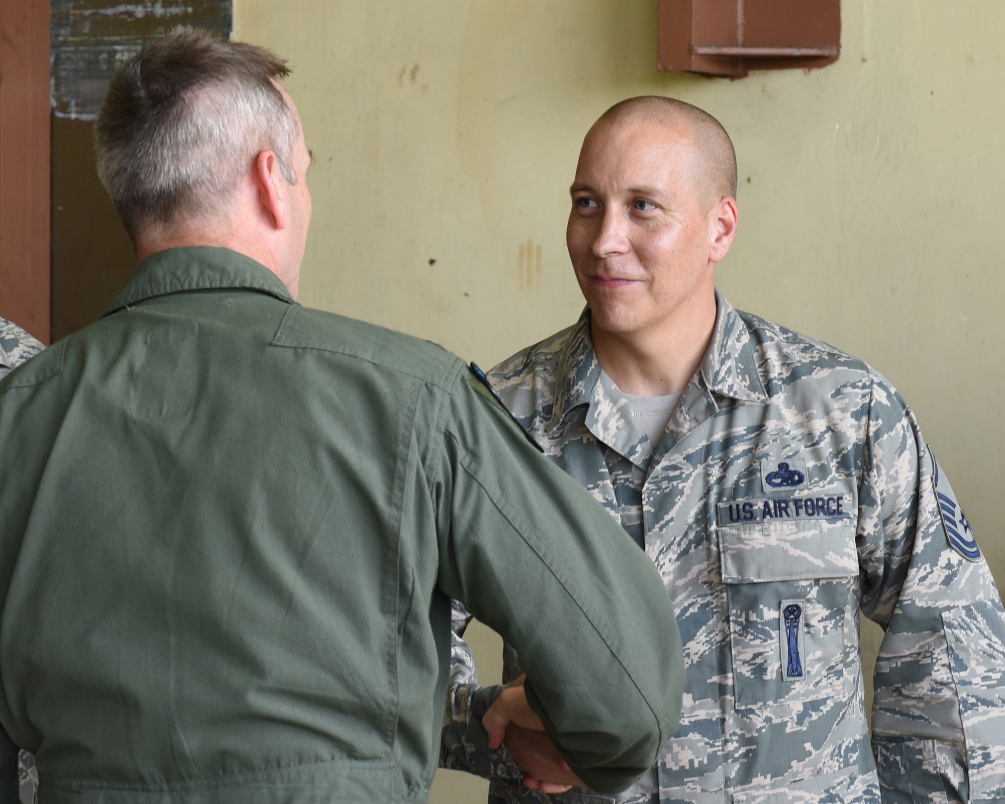 U.S. Air Force Gen. Terrence J. O’Shaughnessy, Pacific Air Forces commander, left, thanks Master Sgt. Aaron M. Williston, a missile maintenance flight chief with the 36th Munitions Squadron, for his hard work and dedication Jan. 31, 2017, at Andersen Air Force Base, Guam. O'Shaughnessy had the opportunity to see firsthand how Airmen at Andersen AFB execute U.S. Pacific Command’s continuous bomber presence mission. The Airmen who fly and support the CBP mission, provide a significant capability that enables U.S. readiness and commitment to deterrence, provides assurances to our allies, and strengthens regional security and stability in the Indo-Asia-Pacific region. (U.S. Air Force photo by Airman 1st Class Jacob Skovo)
