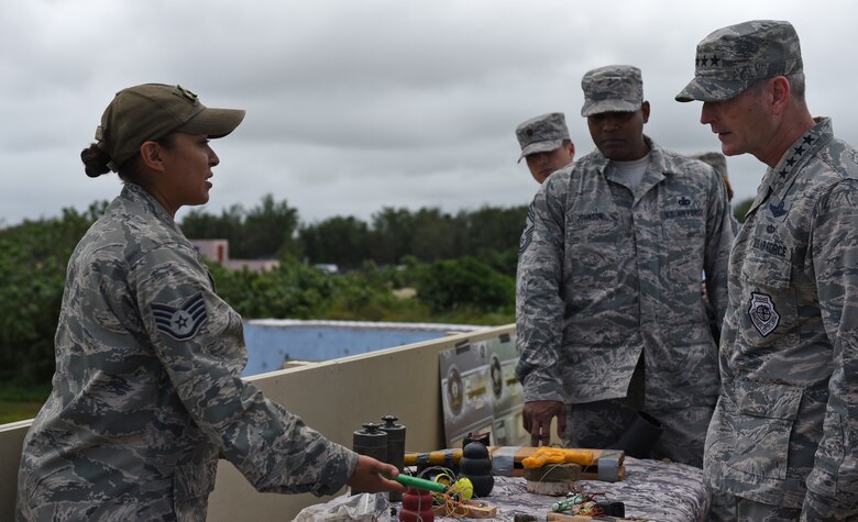 U.S. Air Force Staff Sgt. Patrica Eckles, left, noncommissioned officer in charge military working dog operations with to the 736th Security Forces Squadron, briefs Gen. Terrence J. O’Shaughnessy, Pacific Air Forces commander, and Chief Master Sgt. Anthony Johnson, Pacific Air Forces command chief, on the different types of commonly found improvised explosive devices Feb. 1, 2017, at Andersen Air Force Base, Guam. During the visit, O’Shaughnessy and Johnson had the opportunity to see firsthand the capabilities of the 736th SFS and the techniques they use to secure and defend an airbase in an austere environment. (U.S. Air Force photo by Airman 1st Class Jacob Skovo)
