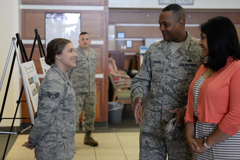 Senior Airman Carli Ziegler, left, with the 36th Medical Support Squadron, briefs Chief Master Sgt. Anthony Johnson, Pacific Air Forces command chief and his spouse, on the support the medical clinic provides Feb. 1, 2017, at Andersen Air Force Base, Guam. During his visit, Johnson visited with Airmen and Soldiers from across the base to gain a firsthand understanding of their mission, their capabilities and the base resources available to them. (U.S. Air Force photo by Airman 1st Class Jacob Skovo)
