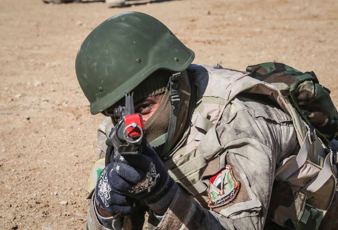 An Iraqi security forces soldier aims his M16 rifle at a target during react to contact training at Al Asad Air Base, Iraq, Feb. 1, 2017. Training at building partner capacity sites is an integral part of Combined Joint Task Force – Operation Inherent Resolve’s effort to train ISF personnel.  CJTF-OIR is the global Coalition to defeat ISIL in Iraq and Syria.  (U.S. Army photo by Sgt. Lisa Soy)