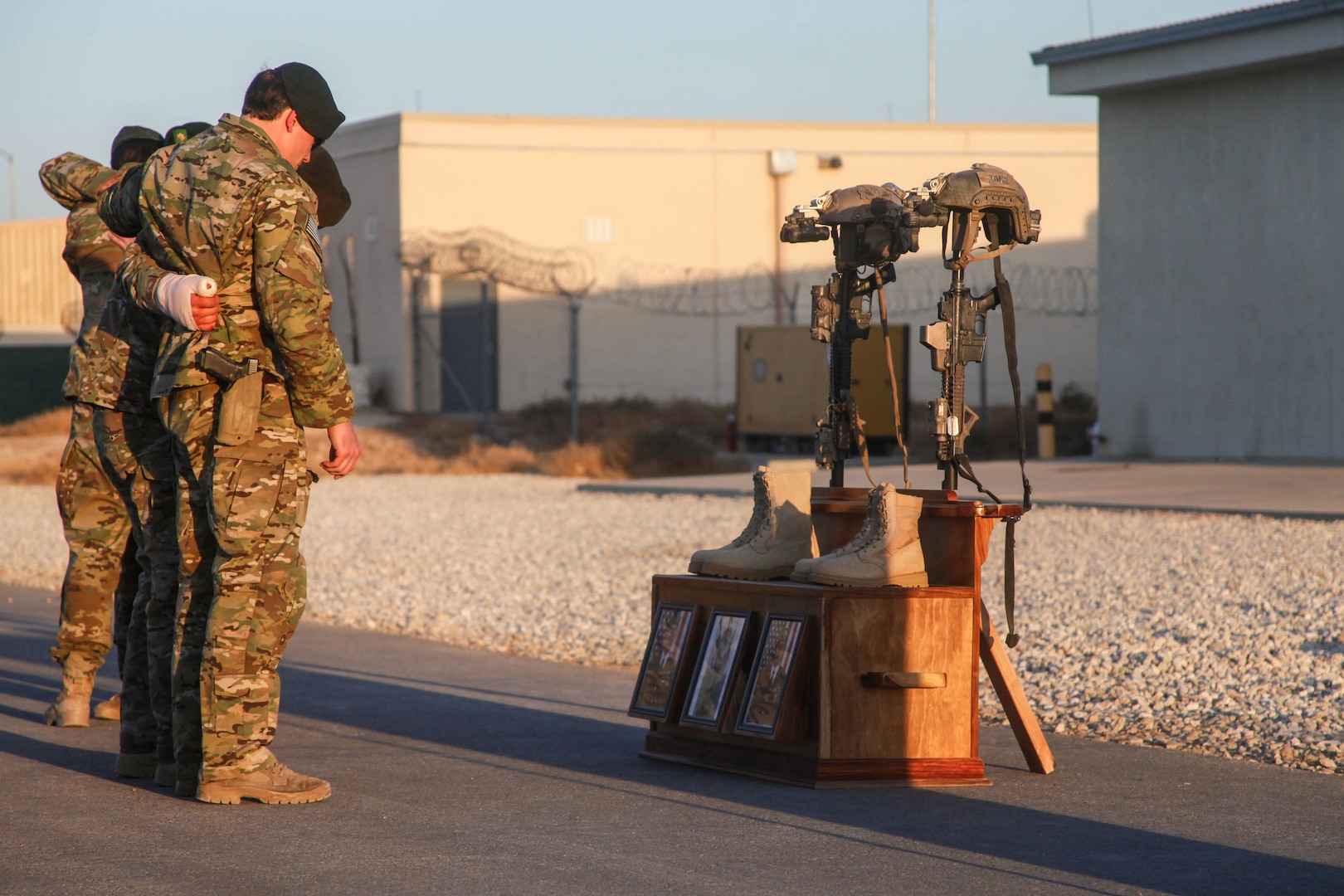 Soldiers of Special Forces Operational Detachment - Alpha 0224, 10th Special Forces Group (Airborne) memorialize two of their fallen brothers during a memorial held at Kunduz Airfield in Afghanistan on Nov. 7, 2016. Maj. Andrew Byers, the commander for ODA 0224, and Sgt. 1st Class Ryan Gloyer, an intelligence sergeant with ODA 0224, were killed in action during the Battle of Boz Qandahari, Afghanistan, on Nov. 2-3, 2016. (U.S. Army photo by Sgt. Connor Mendez/Reviewed)