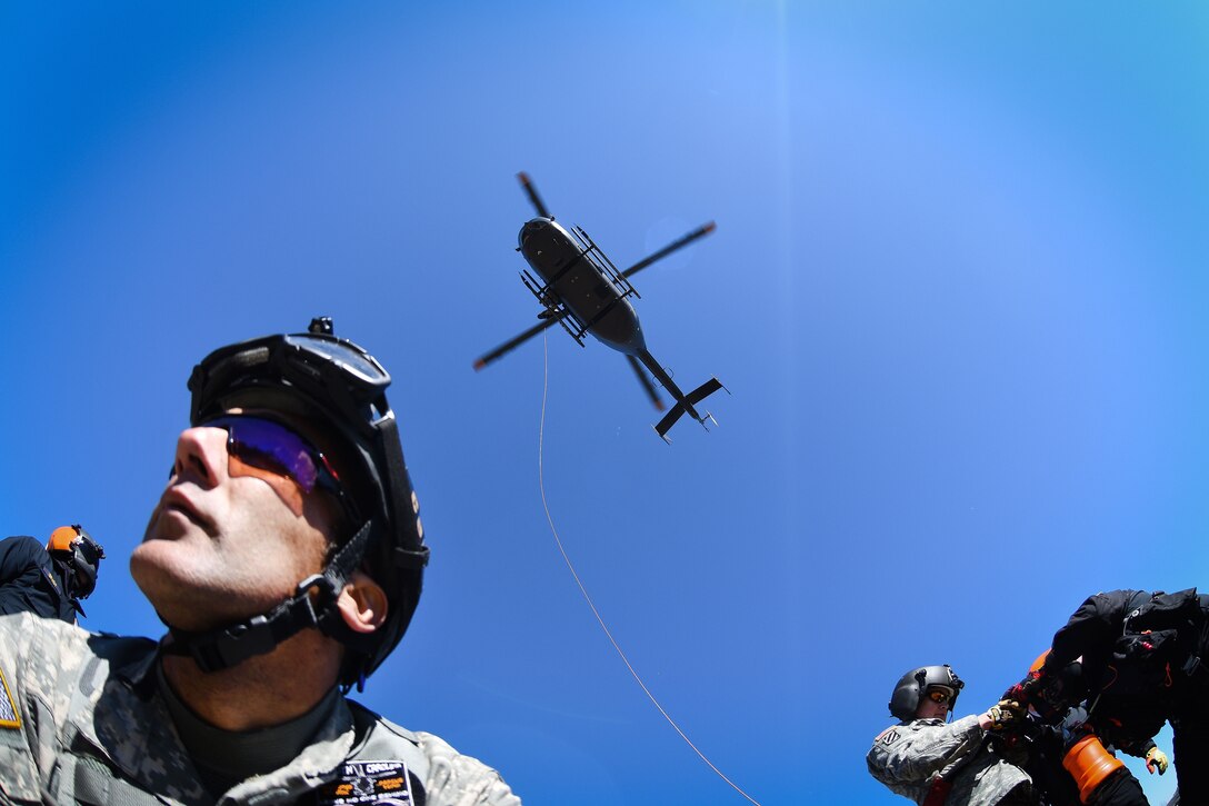 Army National Guardsmen, firefighters and emergency medical services rescuers from the South Carolina Helicopter Aquatic Rescue Team, and the South Carolina Urban Search and Rescue Task Force 1, participate in hoist training operations during the first phases of Patriot South Exercise 2017, at the Gulfport and Port Bienville Industrial Complex, Mississippi, Jan. 29, 2017. Army National Guard photo by Staff Sgt. Roberto Di Giovine