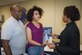 Earl Faulkner, 96th Test Wing, and his daughter, Taylor, listen as Greta Preston, Gulf State College military services coordinator, explains the benefits her college offers Feb. 2 at Eglin Air Force Base, Fla.  The Black History Month Education Fair hosted 13 area colleges for community members to stop by and gather information, in conjunction with this year’s theme, “The Crisis in Black Education.”  (U.S. Air Force photo/Kevin Gaddie)  