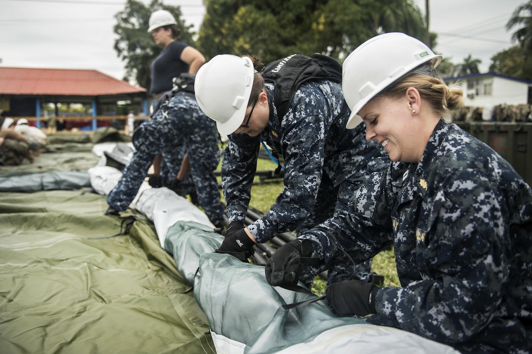 Sailors assemble tents before participating in Continuing Promise 2017 in Puerto Barrios, Guatemala, Jan. 31, 2017. The sailors are assigned to various commands. CP-17 is a U.S. Southern Command-sponsored and U.S. Naval Forces Southern Command/U.S. 4th Fleet-conducted deployment to conduct civil-military operations including humanitarian assistance, training engagements, and medical, dental, and veterinary support in an effort to show U.S. support and commitment to Central and South America. Navy photo by Petty Officer 2nd Class Ridge Leoni