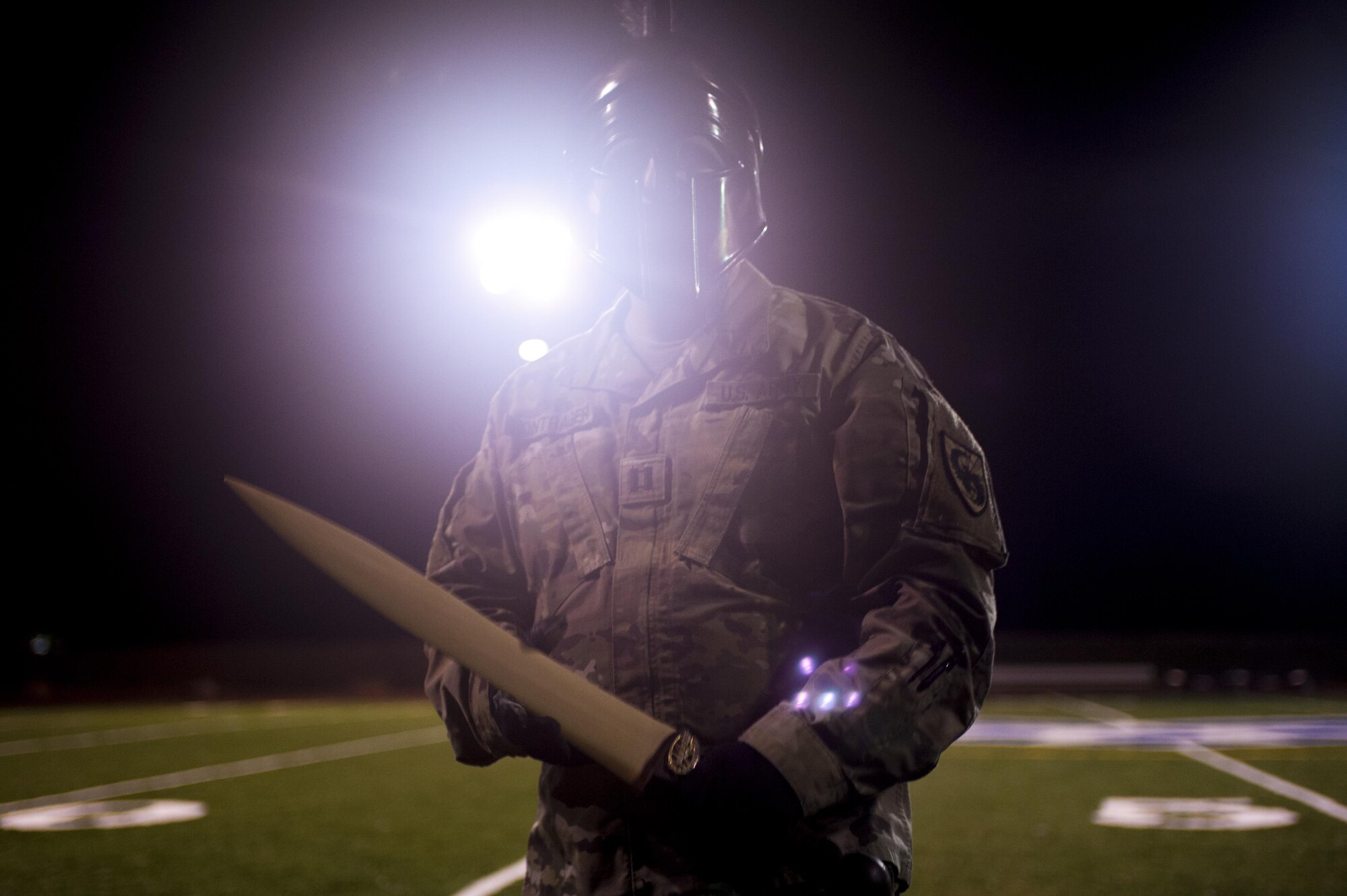 U.S Army Capt. Matthew Bontrager, 344th MIB Alpha Company commander, poses with galea and broadsword trophies after winning the Spartan Race at the Mathis football field on Goodfellow Air Force Base, Texas, February 3, 2017. The Spartan Race pits A and B Company against each other, the winner awarded a black galea helmet and broadsword. (U.S. Air Force photo by Senior Airman Scott Jackson/Released)