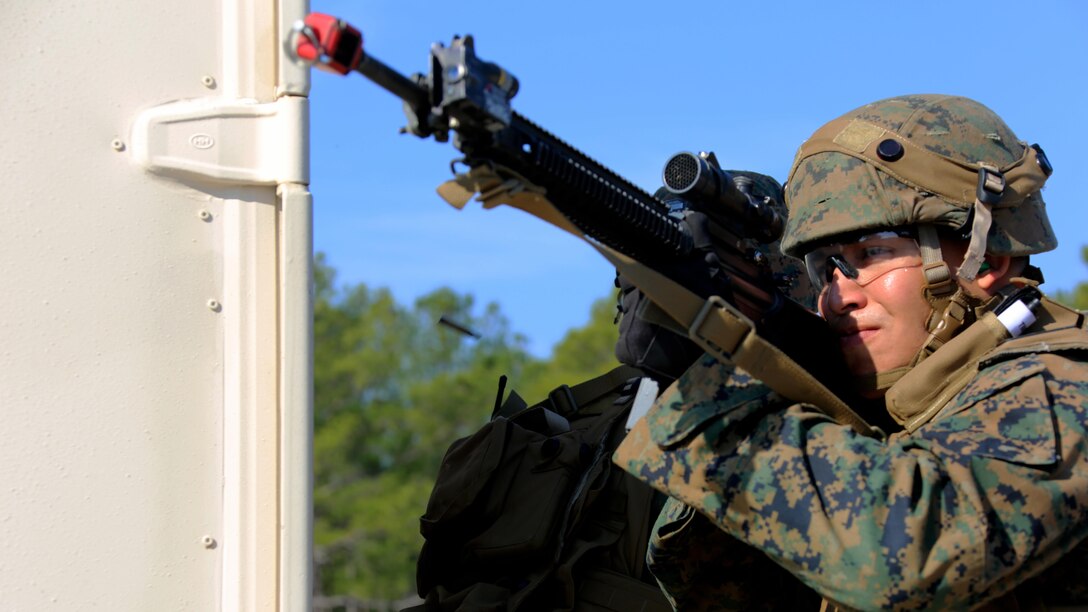 A Marine lays cover fire during Military Operations in Urban Terrain training aboard Marine Corps Outlying Field Atlantic, N.C., Feb. 2, 2017. Nearly 40 Marines with supporting personnel participated in the weeklong training that simulated hostile takeovers and how to overcome unexpected situations with small unit leadership. “This [training] gave small unit leaders the chance to train the Marines to help them become more in-tune to the life or death situations they may encounter,” said Cpl. Christian Leishman, a squad leader for the exercise. The Marine is assigned to Marine Wing Support Squadron 271, Marine Aircraft Group 14, 2nd Marine Aircraft Wing. 