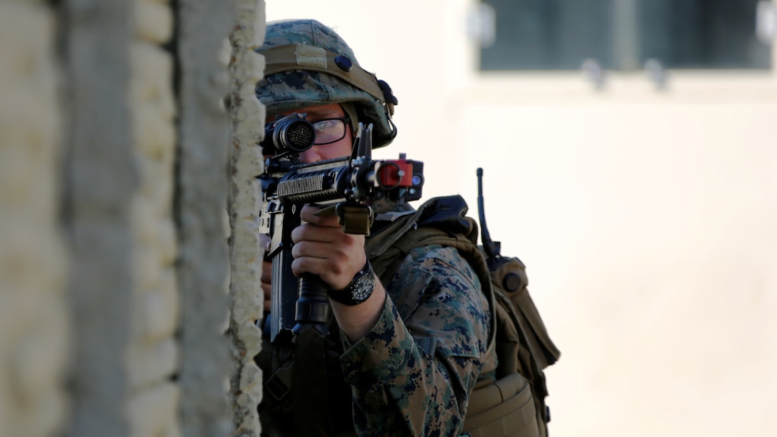 Pfc. Jacob Maze peers through his scope during Marine Wing Support Squadron 271’s Military Operations in Urban Terrain training aboard Marine Corps Outlying Field Atlantic, N.C., Feb. 2, 2017. With corporal being the highest rank participating in the building-clearing, small unit leadership was tested with constantly shifting leadership positions. “My end goal is to ensure any of my Marines are able to take my place if the situation arises,” said Cpl. Christian Leishman, a squad leader for the exercise. Maze is an engineer equipment operator with MWSS-271, Marine Aircraft Group 14, 2nd Marine Aircraft Wing. (U.S. Marine Corps photo by Cpl. Jason Jimenez/ Released)