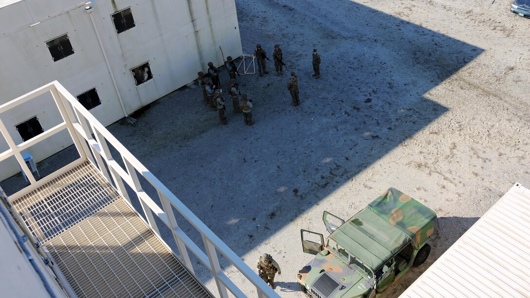 Marines run through a plan of attack during Military Operations in Urban Terrain training aboard Marine Corps Outlying Field Atlantic, N.C., Feb. 2, 2017. Nearly 40 Marines with supporting personnel participated in the weeklong training that simulated hostile takeovers and how to overcome unexpected situations with small unit leadership. Squads of Marines took turns acting as enemy forces to create an increasingly realistic combat scenario for their counterparts. The Marines are assigned to Marine Wing Support Squadron 271, Marine Aircraft Group 14, 2nd Marine Aircraft Wing. 