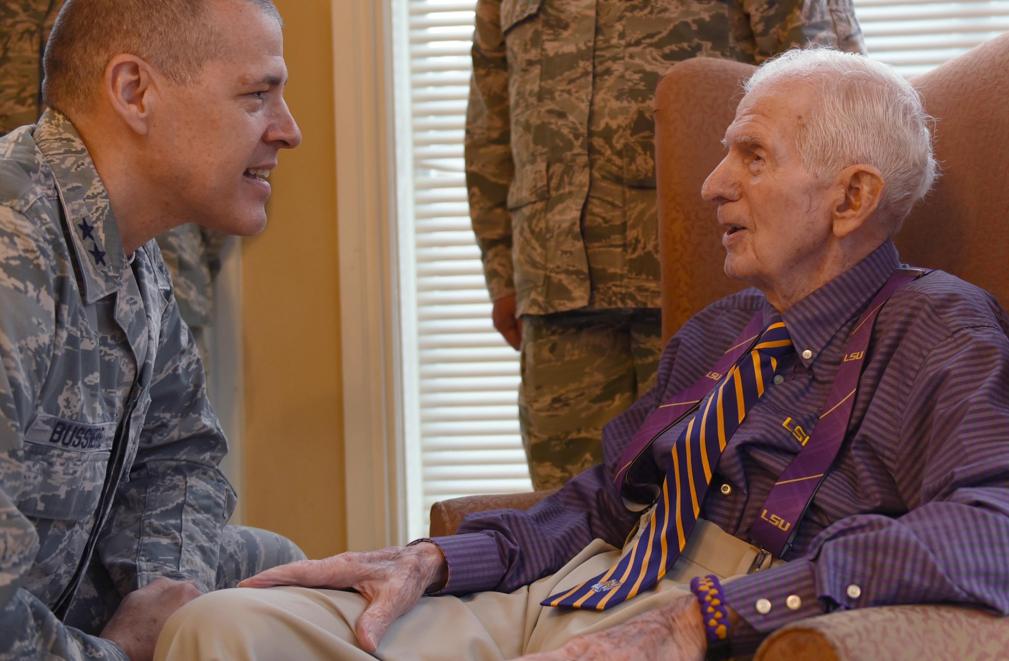 U.S. Air Force Maj. Gen. Thomas Bussiere, 8th Air Force commander, speaks with 93-year-old World War II veteran Raymond Odom during Odom’s dog tag presentation at Arbor Rose Assisted Living Facility in Farmerville, La., Feb. 2, 2017. Odom was reunited with his lost dog tags during the 8th Air Force 75th Anniversary event after more than 70 years.  (U.S. Air Force photo by Senior Airman Erin Trower)
