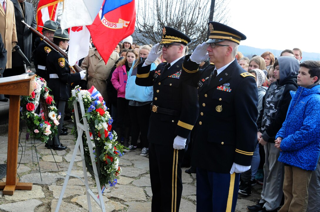 Brigadier General Stephen E. Strand, left, deputy commanding general, and Chaplain (Maj.) Scott Hagen, deputy command chaplain, for the 88th Regional Support Command, salute the wreath they placed at the base of the William Henry Harrison tomb on behalf of President Donald J. Trump, during the ceremony honoring the ninth President of the United States, Feb. 3, 2017.