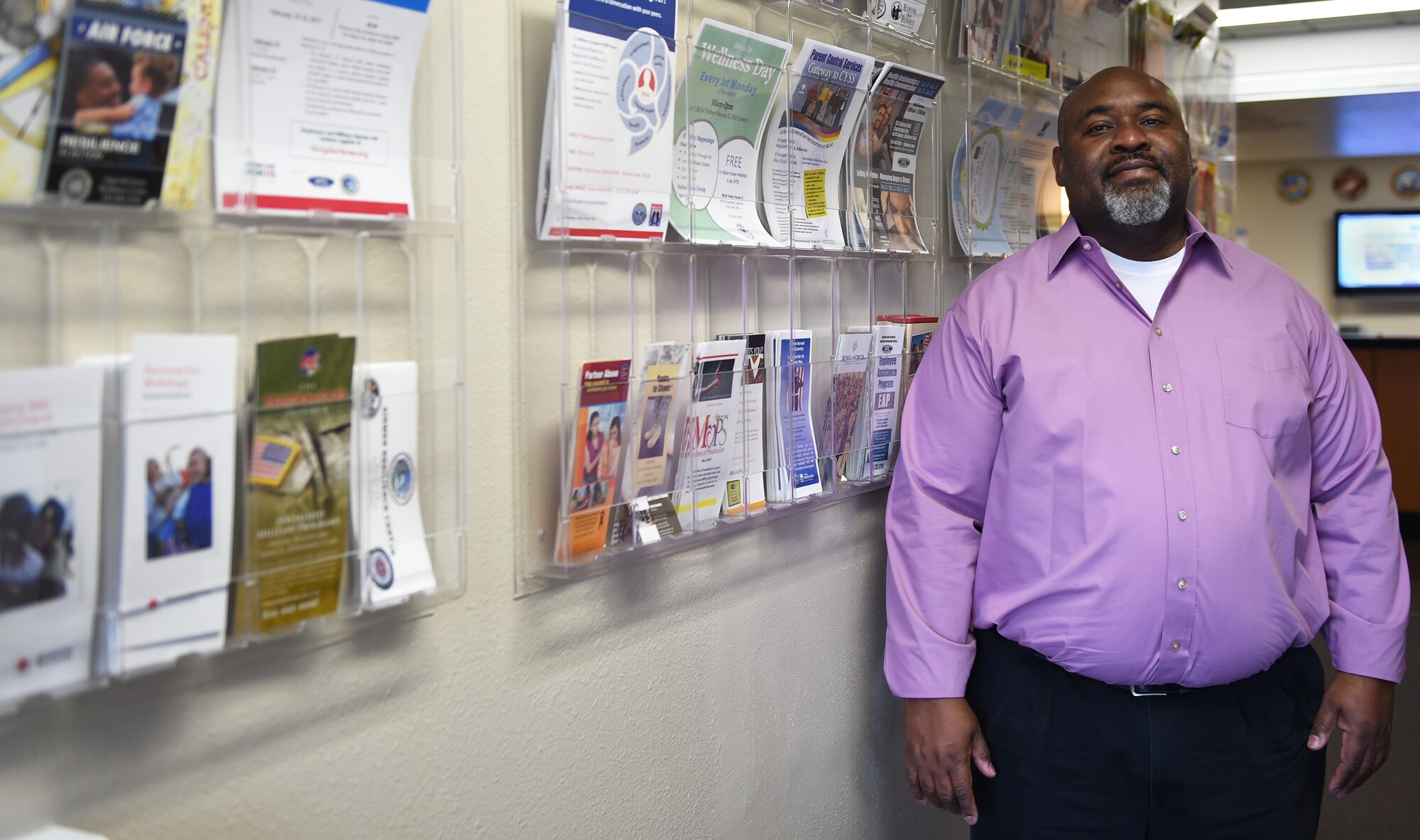 Carl Newhouse, Joint Base Lewis-McChord senior Employee Assistance Program coordinator, stands in the lobby of the Armed Forces Community Service Center at JBLM, Wash. Jan. 26, 2017. The EAP offers communication classes, work force development, civility classes, workplace violence classes, diversity classes and short term counseling for DoD civilians, retirees, dependent, and active duty personnel. (U.S. Air Force photo/Staff Sgt. Naomi Shipley) 