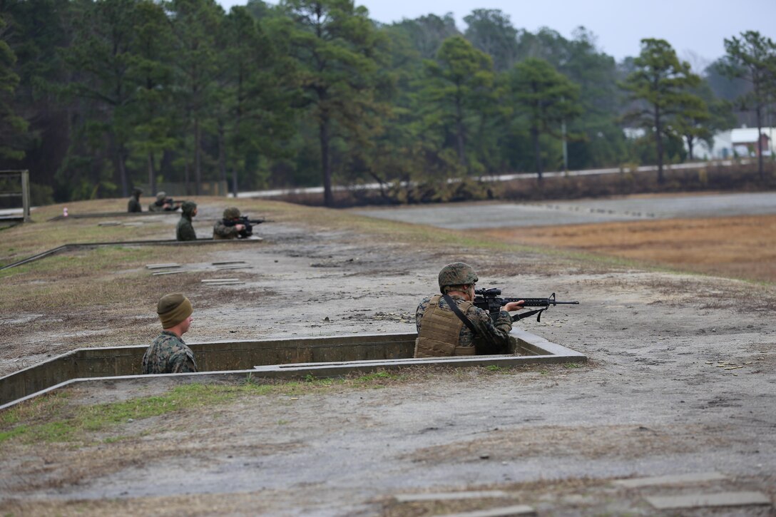 Marines with Transportation Support Company, Combat Logistics Battalion 2, fire from the standing position during a live fire exercise at Camp Lejeune, N.C., Feb. 3, 2017. The Marines conducted the training in order to familiarize themselves with their newly issued rifles in preparation for annual rifle qualifications. The Marines were able to get their Battle Sight Zero (BZO) to provide accurate and effective training as they continue on to other ranges in the coming months. (Marine Corps photo by Cpl. Shannon Kroening)