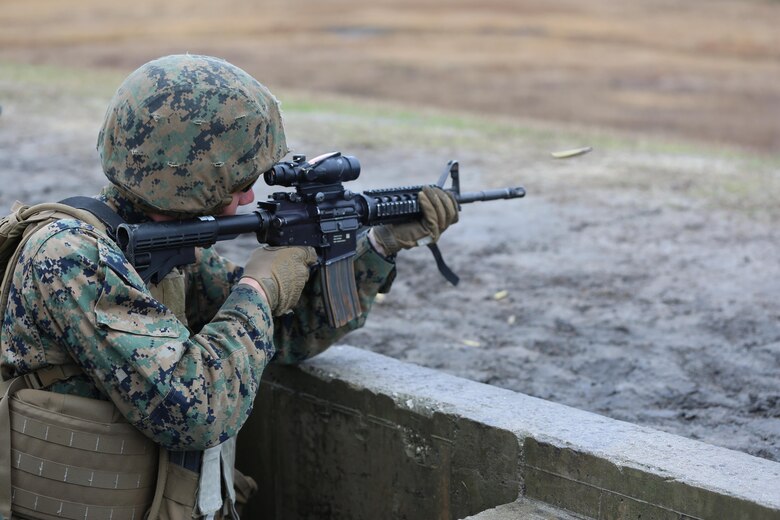 Pfc. Louis Hoobs with Transportation Support Company, Combat Logistics Battalion 2, fires from the standing position during a live fire exercise at Camp Lejeune, N.C., Feb. 3, 2017. The Marines conducted the training in order to familiarize themselves with their newly issued rifles in preparation for annual rifle qualifications. The Marines were able to get their Battle Sight Zero (BZO) to provide accurate and effective training as they continue on to other ranges in the coming months. (Marine Corps photo by Cpl. Shannon Kroening)
