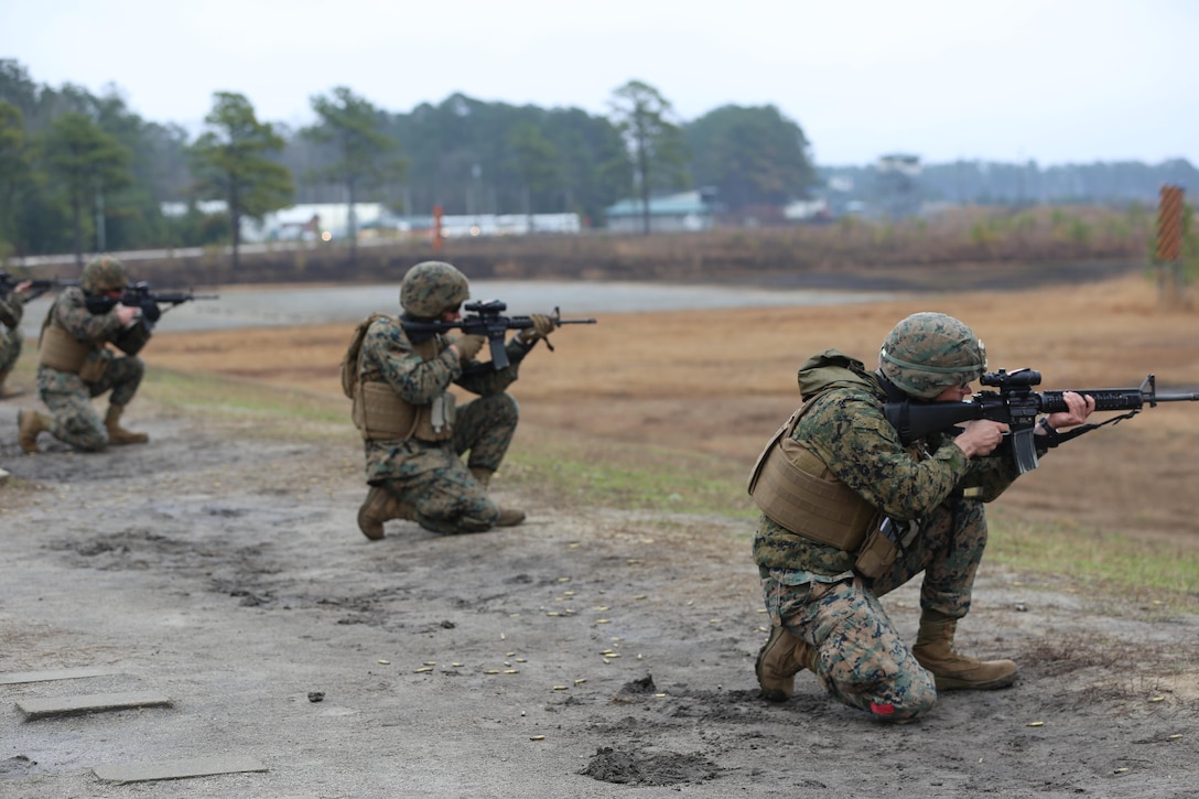 Marines with Transportation Support Company, Combat Logistics Battalion 2, firing from the kneeling position during a live fire exercise at Camp Lejeune, N.C., Feb. 3, 2017. The Marines conducted the training in order to familiarize themselves with their newly issued rifles in preparation for annual rifle qualifications. The Marines were able to get their Battle Sight Zero (BZO) to provide accurate and effective training as they continue on to other ranges in the coming months. (Marine Corps photo by Cpl. Shannon Kroening)