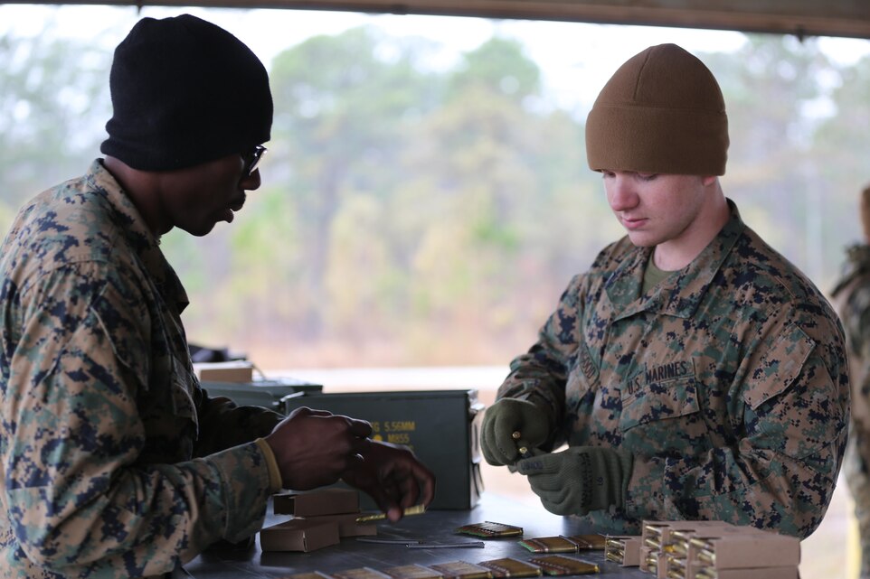 Marines with Transportation Support Company, Combat Logistics Battalion 2, count and prepare the ammunition to be used for training during a live fire exercise at Camp Lejeune, N.C., Feb. 3, 2017. The Marines conducted the training in order to familiarize themselves with their newly issued rifles in preparation for annual rifle qualifications. The Marines were able to get their Battle Sight Zero (BZO) to provide accurate and effective training as they continue on to other ranges in the coming months. (Marine Corps photo by Cpl. Shannon Kroening)