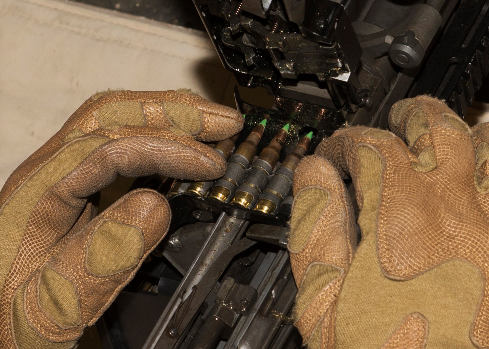 A 5th Security Forces Squadron combat arms training and maintenance student loads a magazine into an M249 light machine gun at the CATM site on Minot Air Force Base, N.D., Feb. 1, 2017. CATM provides firearm training to personnel on the installation. (U.S. Air Force photo/Airman 1st Class Alyssa M. Akers)