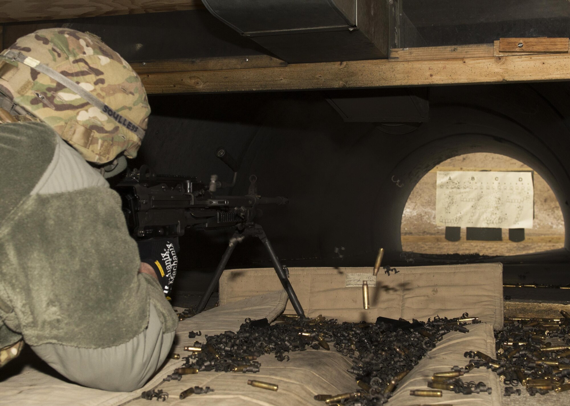 A 5th Security Forces Squadron combat arms training and maintenance student fires an M249 light machine gun at the CATM site on Minot Air Force Base, N.D., Feb. 1, 2017. CATM instructors work with each student as they learn how to properly use this firearm to ensure the safety of the student and those around them. (U.S. Air Force photo/Airman 1st Class Alyssa M. Akers)