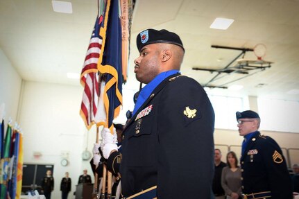 Army Reserve Spc. Thomas Townsend, 85th Support Command color guard team, presents the Colors during the command's retirement ceremony, Jan. 7, 2017. Three Soldiers, assigned to the command, retired with a combined 82 years of service.
(Photo by Sgt. Aaron Berogan)