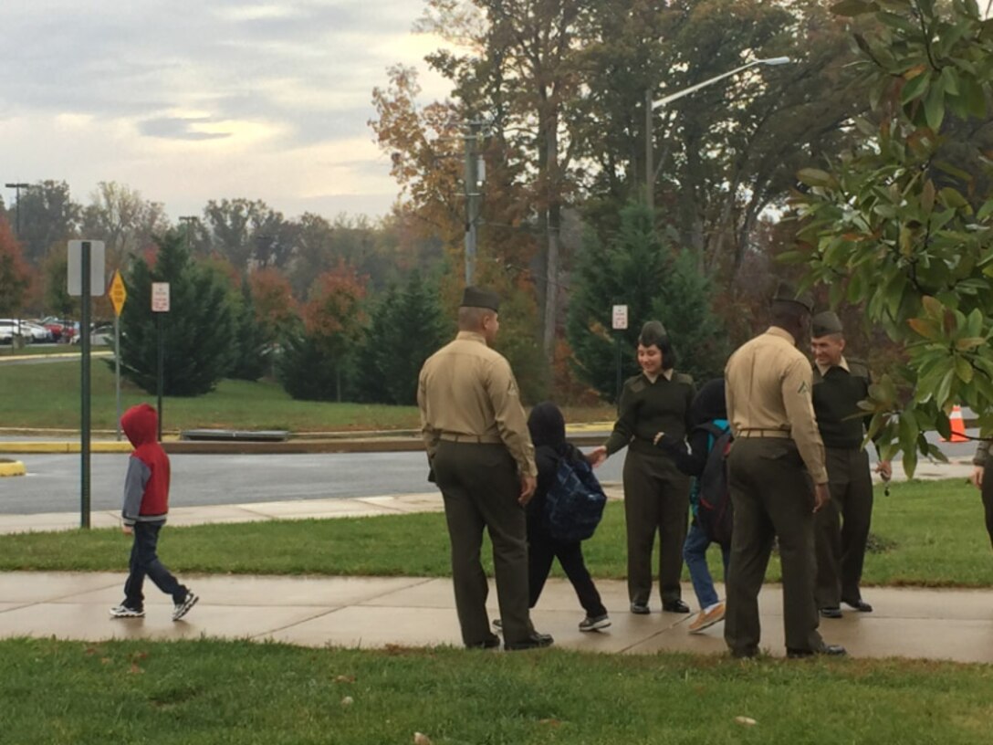 Marines braving the rain at Thornburg Middle School.