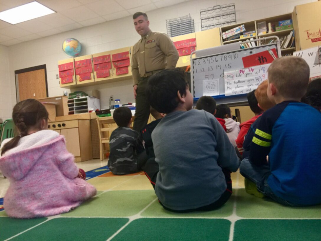 Capt Magyar helps out in class.