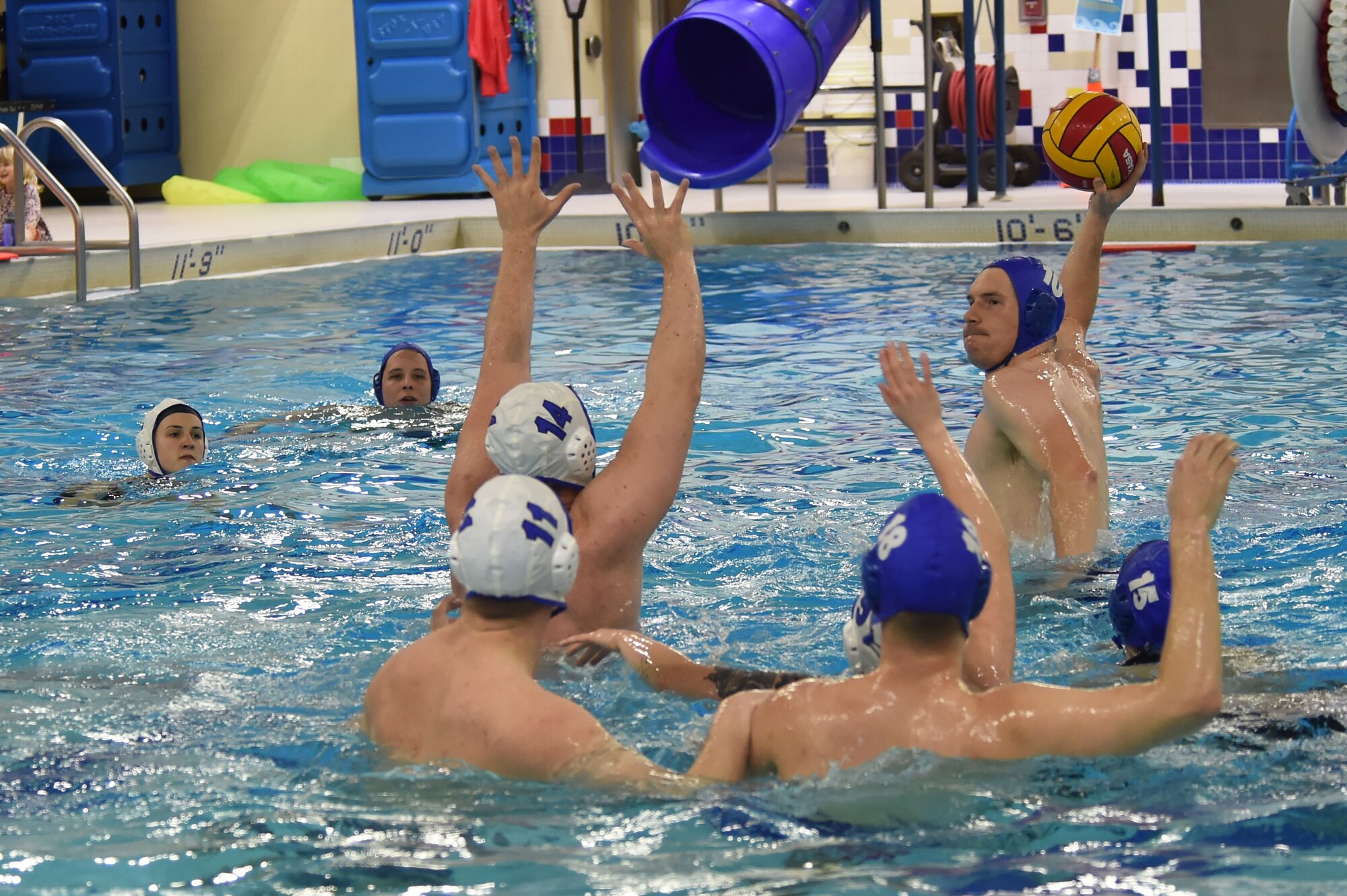Service members participate in a water polo practice session at the Buckner Physical Fitness Center pool at Joint Base Elmendorf-Richardson, Alaska, Feb. 1, 2017. The inner tube water polo intramural season will continue through to April, with games each Wednesday. 