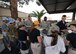 Airmen and their families receive a free meal from the 56th Fighter Wing chaplain office at the monthly flight line feast, Feb. 2, 2017 at Luke Air Force Base, Ariz. In addition to community outreach events, the chaplains office is available to Airmen for religious guidance, confidential counseling or just for someone to talk to. (U.S. Air Force photo by Airman 1st Class Caleb Worpel)