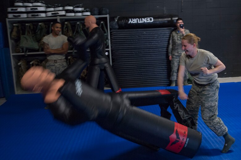 Senior Airman Jaimie Bennett, 23d Operations Support Squadron air traffic controller, strikes a dummy at a Survival Evasion Resistance Escape course during the Tour of Champions, Feb. 3, 2017, at Moody Air Force Base, Ga. All annual award nominees had an opportunity to partake in an array of events during the Tour of Champions. (U.S. Air Force photo by Airman 1st Class Daniel Snider)