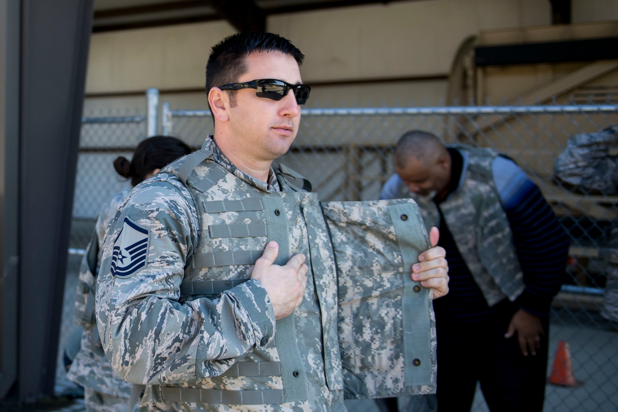 Master Sgt. James Holloway, 23d Logistics Readiness Squadron fuel operations superintendent, secures his armored vest before participating in a mine-resistant, ambush-protected (MRAP) vehicle roll-over simulator, Feb. 3, 2017, at Moody Air Force Base, Ga. The group had the opportunity to experience both the MRAP and Humvee roll-over simulators. (U.S. Air Force photo by Airman 1st Class Daniel Snider)
