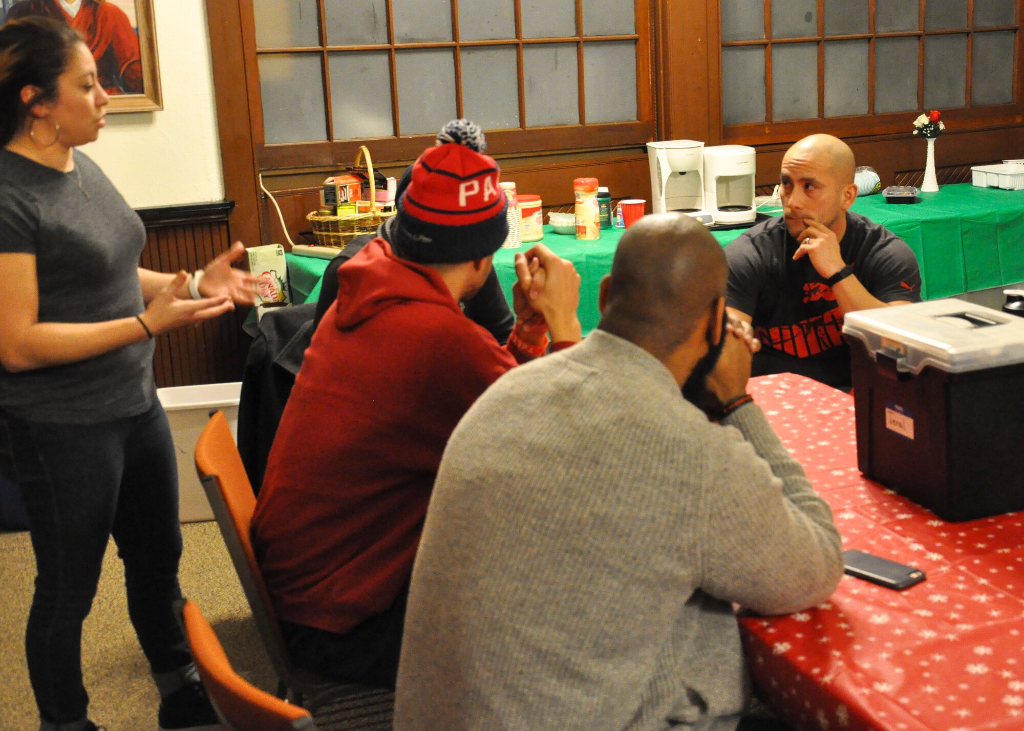 Master Sgt. Orlando Salas Jr.(right), 421st Combat Training Squadron instructor, discusses security and event management details with a group of church volunteers near Pemberton, New Jersey, Jan. 27. Salas began attending church and found a passion developing his faith and sharing the opportnity with others. Salas is the acting Ministry Development leader at the Bridge Worship Center, where he and members of his family now volunteer. Salas has hopes of cotinuing to develop as a person of faith and one day become a pastor. (U.S. Air Force photo by Capt. Matthew Chism)