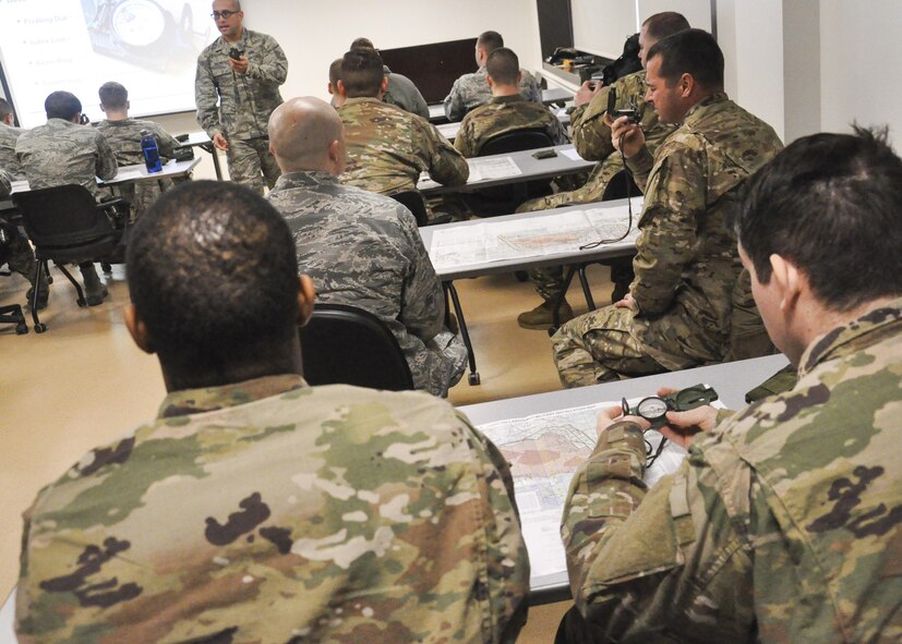 Master Sgt. Orlando Salas Jr., 421st Combat Training Squadron instructor, leads land navigation training during pre-deployment training at the United States Air Force Expeditionary Operation School on Joint Base McGuire-Dix-Lakehurst, New Jersey, Jan. 30. Salas's course is one of the key components of the USAF EOS's Field Craft training series, which prepares general forces Airmen to survive and operate in expeditionary environments. (U.S. Air Force photo by Capt. Matthew Chism)
