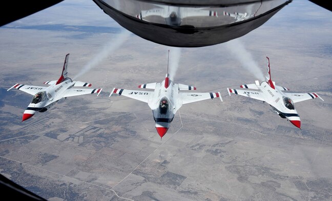 Three F-16 Fighting Falcons fly in formation after receiving fuel from a KC-135 Stratotanker assigned to McConnell Air Force Base, Kan., Feb. 3, 2017, en route to Houston, Texas. The U.S. Air Force Air Demonstration Squadron, the Thunderbirds, will be performing a flyover during the 2017 Super Bowl. (U.S. Air Force photo/Airman 1st Class Erin McClellan)