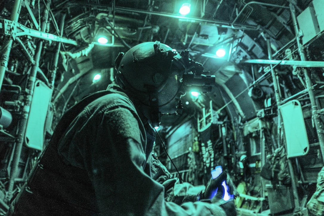 Air Force Tech. Sgt. Nathan Schultz waits to secure a load of cargo in a C-130H Hercules at Qayyarah Airfield West, Iraq, Feb. 3, 2017. Airmen delivered 30,000 pounds of cargo to aide in the fight against ISIL. Air Force photo by Senior Airman Jordan Castelan