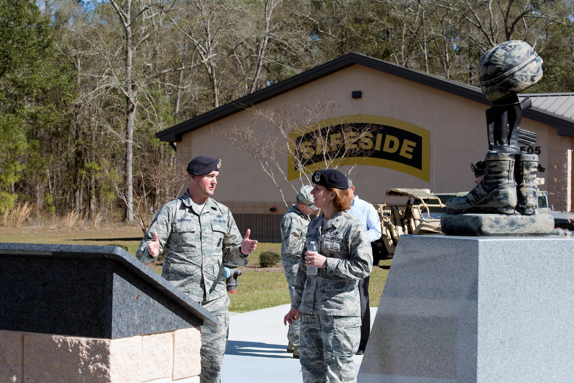 Staff Sgt. Adam Robinson, 820th Base Defense Group NCO in charge of standardizations and evaluation, explains the importance of the 820th BDG memorial to Brig. Gen. Andrea Tullos, Air Force director of security forces, during her visit, Feb. 1, 2017, at Moody Air Force Base, Ga. While touring the 820th BDG’s facilities, Tullos addressed the issues of manning, fiscal constraints, training and areas of improvement to help the defenders better execute the mission. (U.S. Air Force photo by Airman 1st Class Greg Nash)