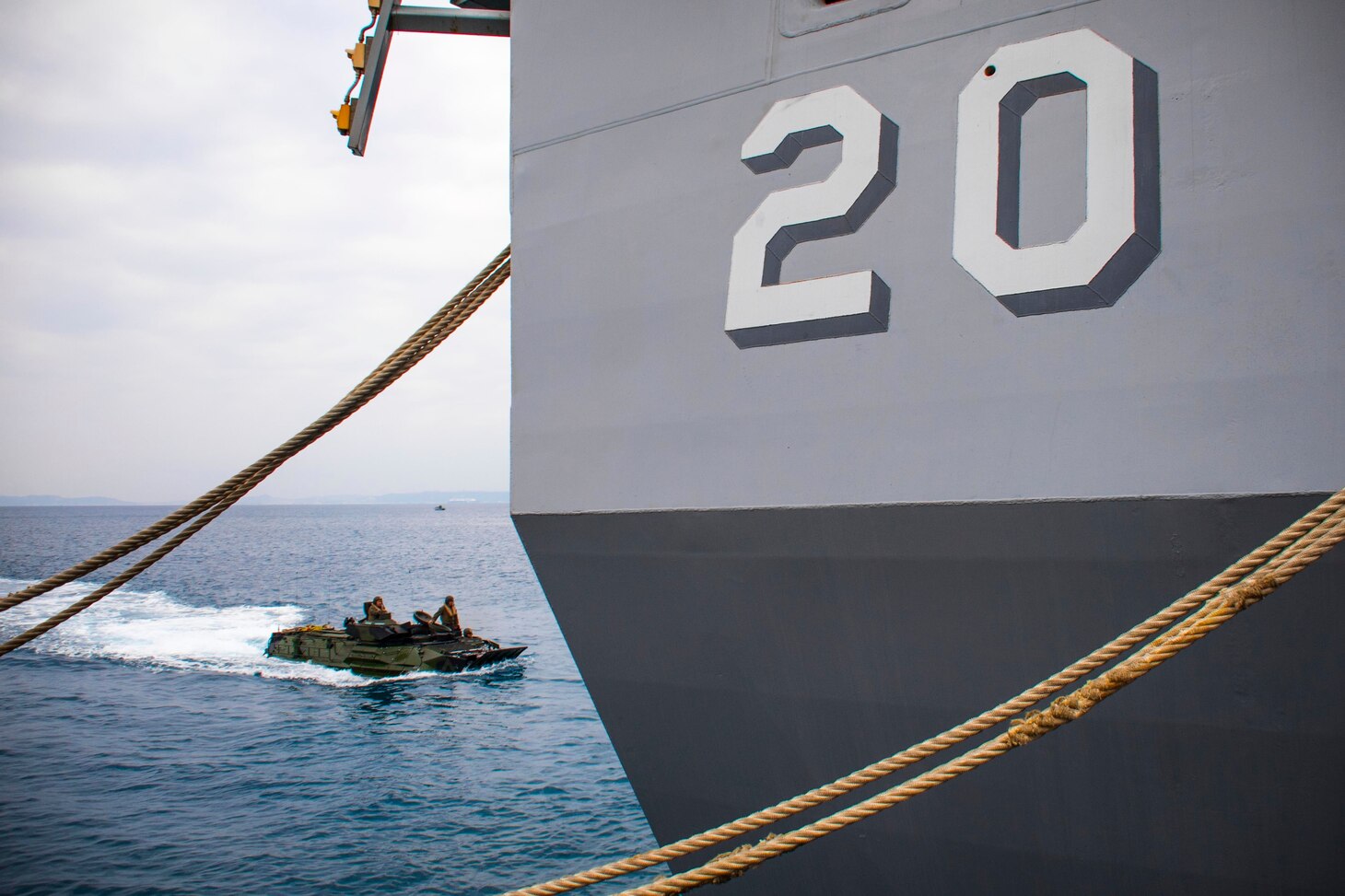 An amphibious assault vehicle assigned to 3rd Battalion, 3rd Marine Regiment, prepares to embark the well deck of the amphibious transport dock ship USS Green Bay (LPD 20). The ship is on a routine patrol operating in the Indo-Asia-Pacific region to enhance partnerships and be a ready-response force for any type of contingency.
