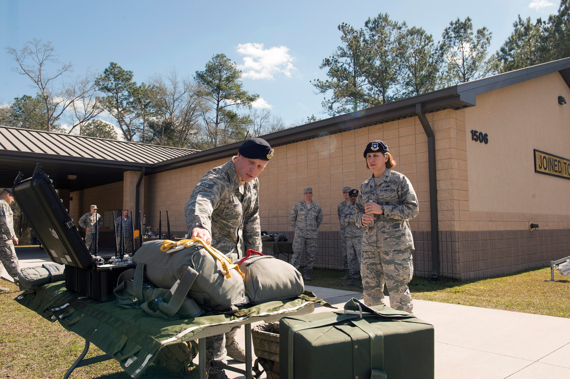 Staff Sgt. Colt Crowe, 820th Combat Operations Squadron parachute program manager, shows the components of a parachute to Brig. Gen. Andrea Tullos, Air Force director of security forces, Feb. 1, 2017, at Moody Air Force Base, Ga. During the visit, Tullos highlighted the future direction of the career field by indicating that developing current and future Airmen with better training and mobilizing the career field to expose defenders to various missions are some of her top priorities. (U.S. Air Force photo by Airman 1st Class Greg Nash)