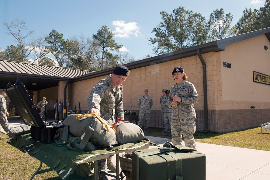 Staff Sgt. Colt Crowe, 820th Combat Operations Squadron parachute program manager, shows the components of a parachute to Brig. Gen. Andrea Tullos, Air Force director of security forces, Feb. 1, 2017, at Moody Air Force Base, Ga. During the visit, Tullos highlighted the future direction of the career field by indicating that developing current and future Airmen with better training and mobilizing the career field to expose defenders to various missions are some of her top priorities. (U.S. Air Force photo by Airman 1st Class Greg Nash)