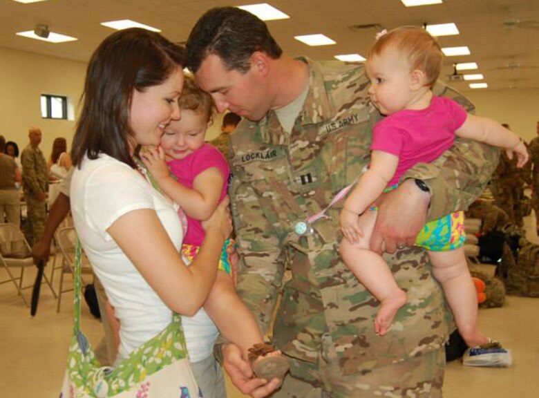 Army Reserve Capt. Richard Locklair says good-bye to his family prior to deployment in August 2013.  Courtesy photo