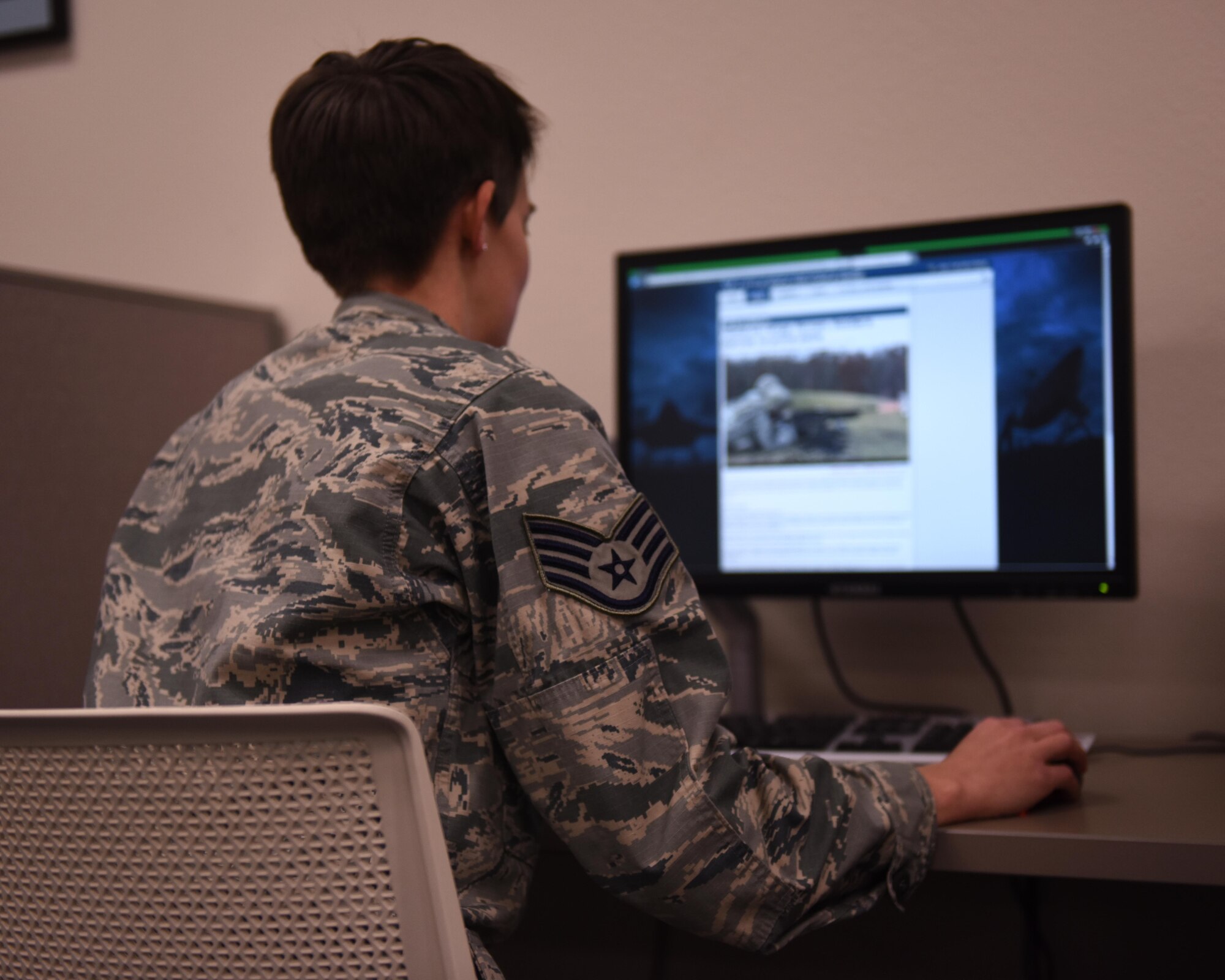 A service member uses a computer at the Little Rock Air Force Base Library Jan. 18, 2017. The LRAFB Library, voted best Air Force library in 2015, offers a variety of amenities to help develop and care for Airmen and their families such as education opportunities, free Wi-Fi throughout the facility, foreign language programs and readily available computers. (U.S. Air Force photo by Airman 1st Class Codie Collins)