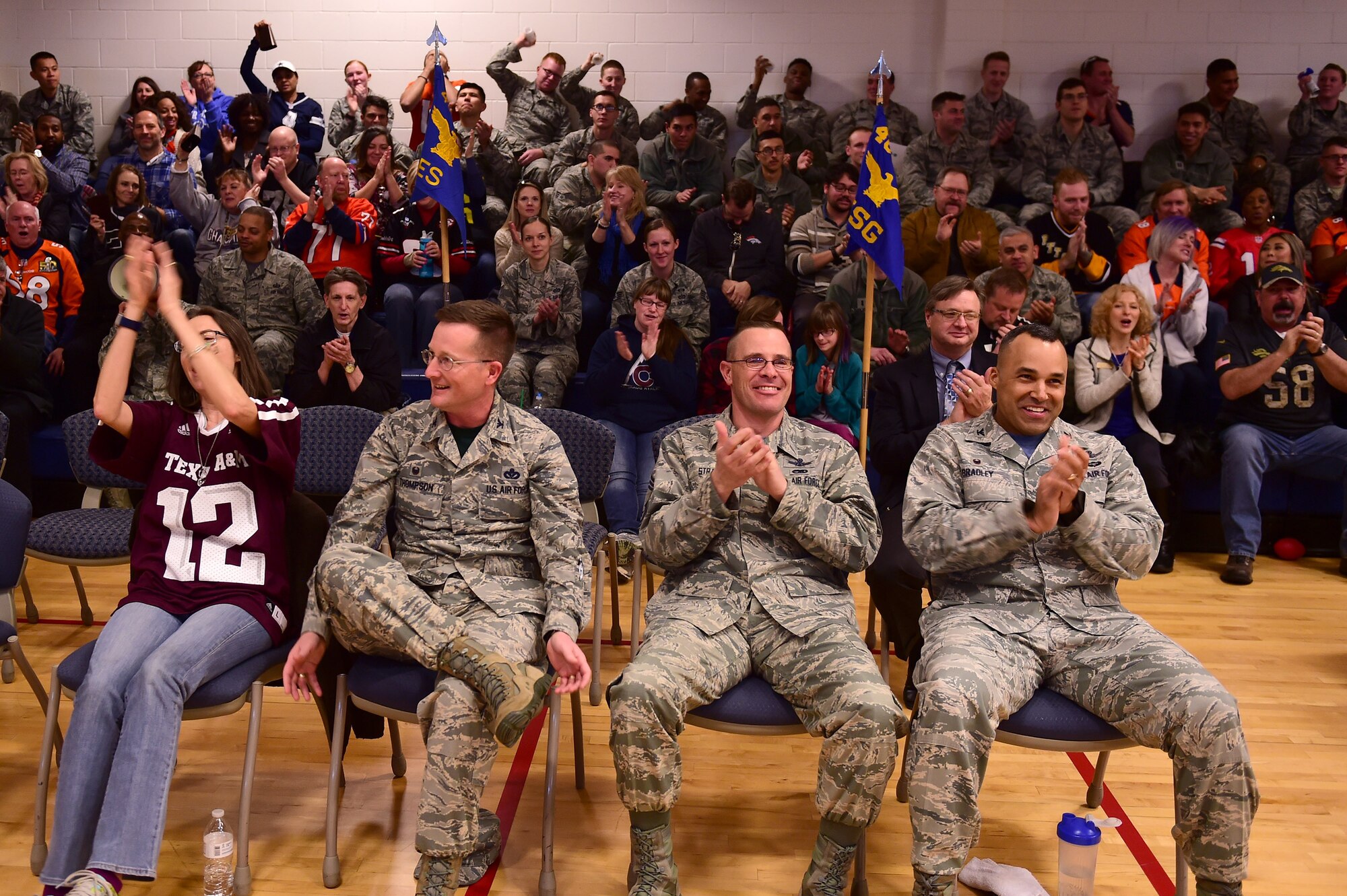 Buckley leadership cheer on the 460th Mission Support Group during the spirit competition Feb. 3, 2017, at the annual awards on Buckley Air Force Base, Colo. The annual awards is an award ceremony that recognizes the significant achievements, dedication and skill of the military and civilian members of the 460th Space Wing. (U.S. Air Force photo by Airman Jacob Deatherage/Released)
