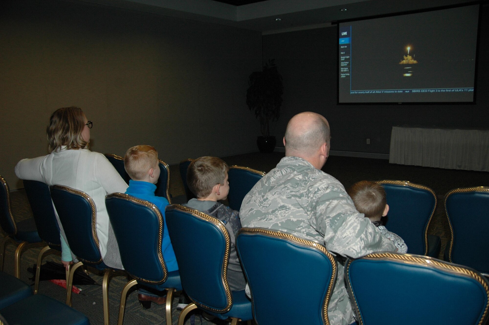 The Mizell family watches an Atlas V 401 rocket successfully lift off Jan. 20 from Cape Canaveral Air Force Station, Florida, carrying the third Space Based Infrared Systems Geosynchronous Earth Orbiting satellite into orbit during an SMC Presents “Launch and Learn” session in the Gordon Conference Center at Los Angeles Air Force Base in El Segundo, California. (U.S. Air Force photo/Jim Spellman)