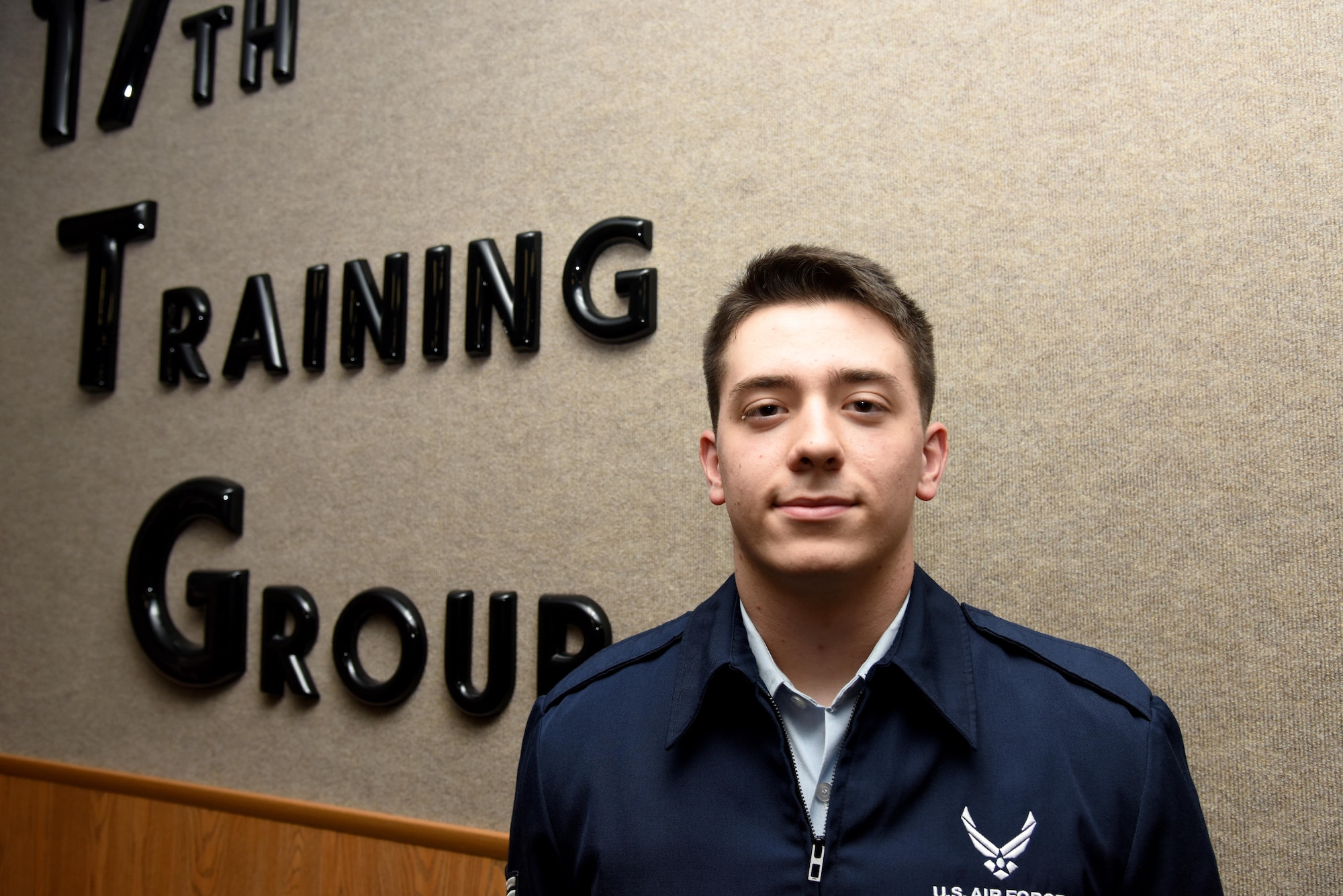 U.S. Air Force Airman 1st Class Craig Irvin, 315th Training Squadron student, smiles for a portrait at Brandenburg Hall on Goodfellow Air Force Base, Texas, Feb. 3, 2017. Irvin is the Goodfellow Student of the Month spotlight for January 2017, a series highlighting Goodfellow students. (U.S. Air Force photo by Staff Sgt. Joshua Edwards/Released)