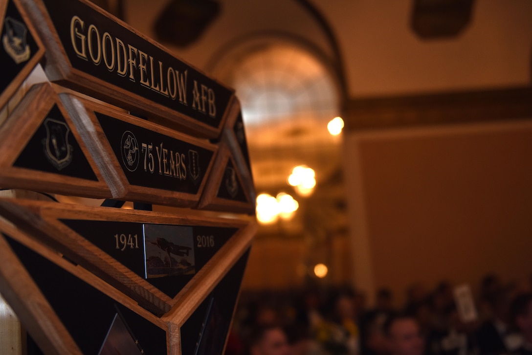 17th Training Wing showcases a plaque celebrating the end of the wing’s diamond anniversary at the Annual Awards Banquet at the Cactus Hotel ballroom, San Angelo, Texas, Feb. 3, 2017. Col. Michael Downs, 17th Training Wing Commander, presented the plaque during the awards ceremony. (U.S. Air Force photo by Airman 1st Class Caelynn Ferguson/Released)