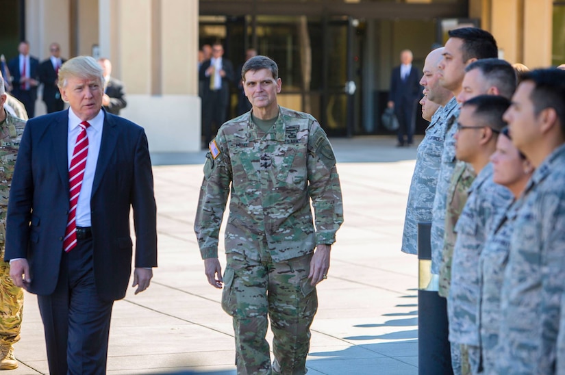 President Donald J. Trump and Army Gen. Joseph L. Votel, commander of U.S. Central Command, spend a few minutes with troops on their way to a news briefing at MacDill Air Force Base, Fla., Feb. 6, 2017. President Trump visited Centcom headquarters to discuss issues relevant to the command’s area of responsibility. U.S. Central Command photo by Marine Corps Sgt. Alan Belser