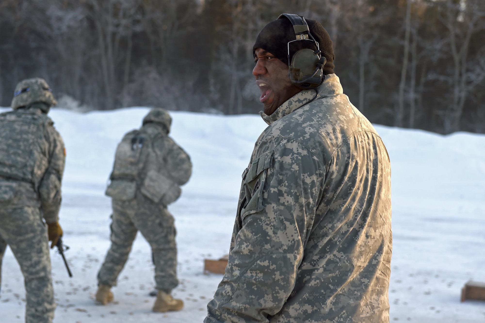 Army Sgt. Robert Lewis, 1st Battalion, 501st Parachute Infantry Regiment, 4th Infantry Brigade Combat Team (Airborne), 25th Infantry Division, U.S. Army Alaska squad leader, directs a group of Soldiers of the 574th Composite Supply Company, 17th Combat Sustainment Support Battalion during a live-fire training exercise, at the Sport Fire Range at Joint Base Elmendorf-Richardson, Alaska, Feb. 2, 2017. Soldiers trained in aircraft refueling, weapons qualification and familiarization and trauma treatment, as well as force-protection measures. 