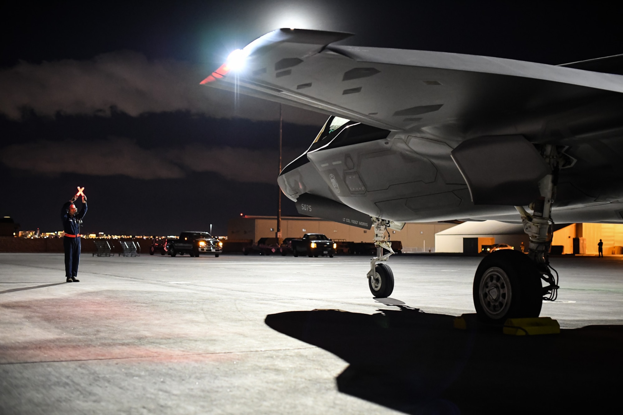 Crew Chief Airman 1st Class Raul Guzman prepares to launch an F-35A Lightning II aircraft piloted by Lt. Col. Yosef Morris, 388th fighter Wing, during Red Flag 17-1, Nellis Air Force Base, Nev., Feb. 3, 2017. Morris flew the 2,000th sortie during the Air Force's premier air-to-air combat training exercise. Pilots and maintainers from the Hill Air Force Base's 388th and 419th Fighter Wings deployed the fifth-generation fighter to Red Flag on Jan. 20. This is the first deployment of the F-35A to a Red Flag exercise. While deployed, the F-35 will fly alongside fourth- and fifth-generation platforms providing offensive and defensive counter air, suppression of enemy air defenses and limited close air support. (U.S. Air Force photo/R. Nial Bradshaw)