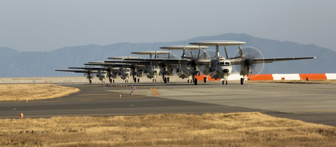 Five U.S. Navy E-2D Advanced Hawkeyes with Carrier Airborne Early Warning Squadron (VAW) 125, land at Marine Corps Air Station Iwakuni, Japan, Feb. 2, 2017. VAW-125 arrived at MCAS Iwakuni from Naval Station Norfolk, Va. The E-2D Advanced Hawkeye is equipped with the most advanced airborne radar in the world, possessing systems which increase the capabilities to defend Japan and provide security in the Indo-Asia-Pacific region. (U.S. Marine Corps photo by Lance Cpl. Jacob A. Farbo)
