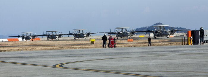 Five U.S. Navy E-2D Advanced Hawkeye with Carrier Airborne Early Warning Squadron (VAW) 125, taxis down the runway at Marine Corps Air Station Iwakuni, Japan, Feb. 2, 2017.VAW-125 arrived at MCAS Iwakuni, from Naval Station Norfolk, Va. The E-2D Advanced Hawkeye is equipped with the most advanced airborne radar in the world, possessing systems which increase the capabilities to defend Japan and provide security in the Indo-Asia-Pacific region. (U.S. Marine Corps photo by Cpl. James A. Guillory)