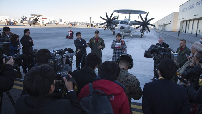 U.S. Navy Cmdr. Daniel Prochazka, commanding officer of Carrier Airborne Early Warning Squadron (VAW) 125, addresses the local media during a press conference upon arrival to Marine Corps Air Station Iwakuni, Japan, Feb. 2, 2017. VAW-125 arrived at MCAS Iwakuni, from Naval Station Norfolk, Va. The E-2D Advanced Hawkeye is equipped with the most advanced airborne radar in the world, possessing systems which increase the capabilities to defend Japan and provide security in the Indo-Asia-Pacific region. (U.S. Marine Corps photo by Cpl. James A. Guillory)